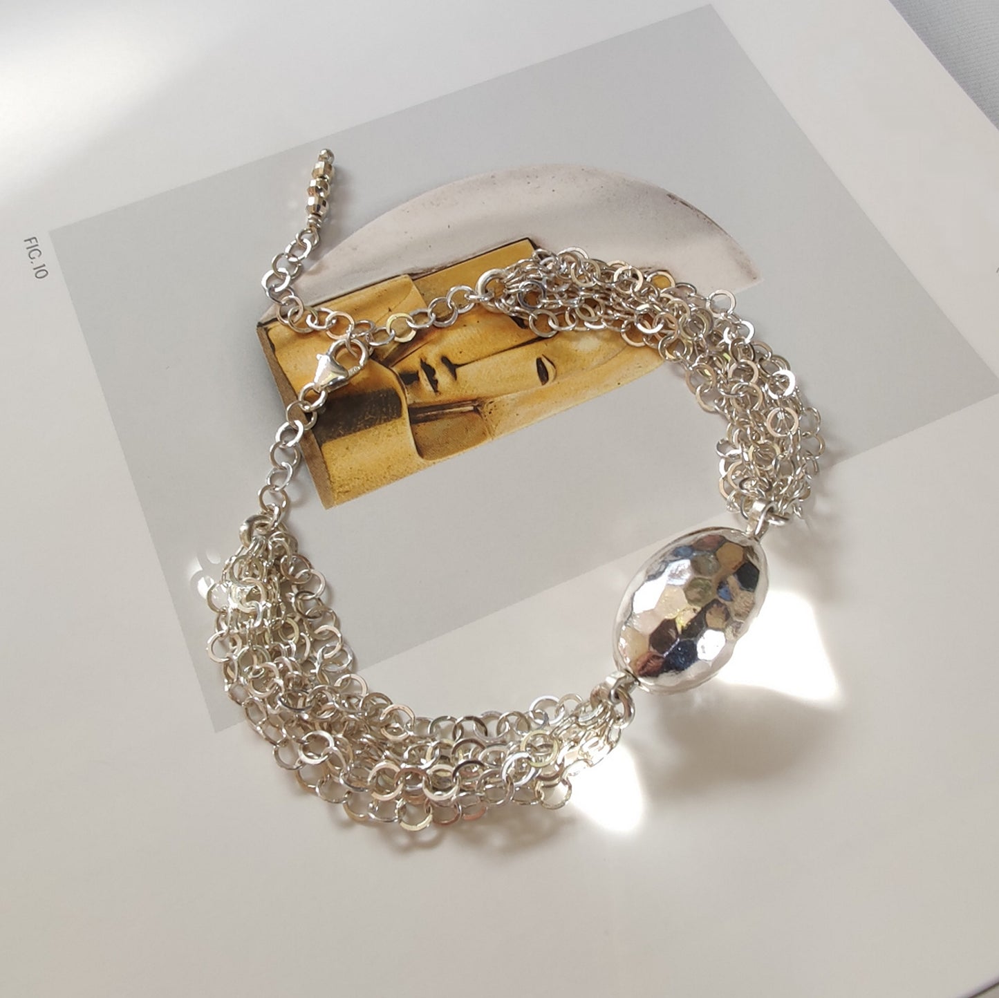 ST53 - Bracciale a maglia interamente in argento con ovale martellato