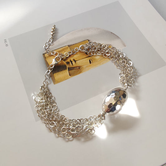 ST73 - Bracciale a maglia interamente in argento con ovale martellato