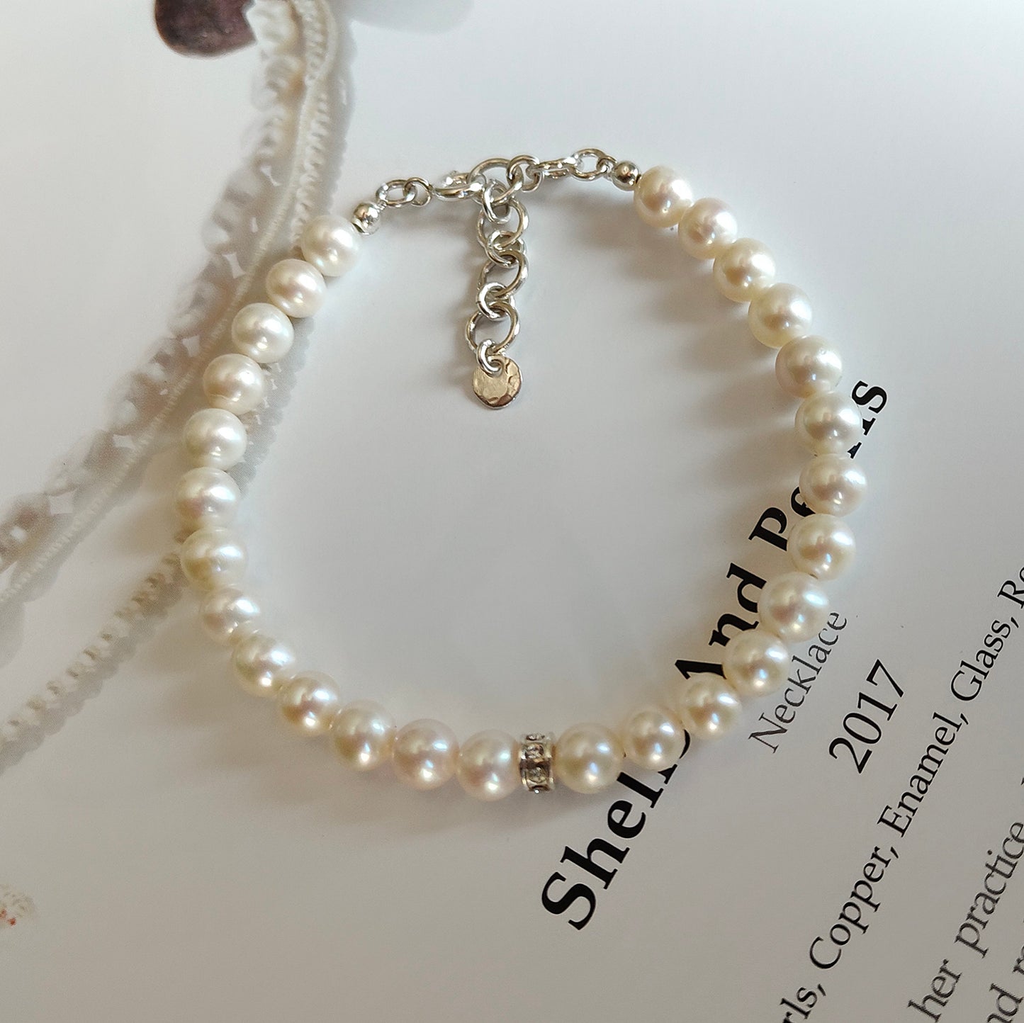 ST031 - Bracciale Perle 6-6,5mm con Dischetto – Argento 925