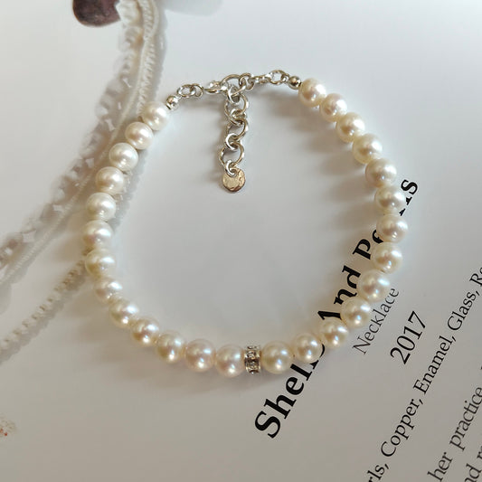 ST031 - Bracciale Perle 6-6,5mm con Dischetto – Argento 925